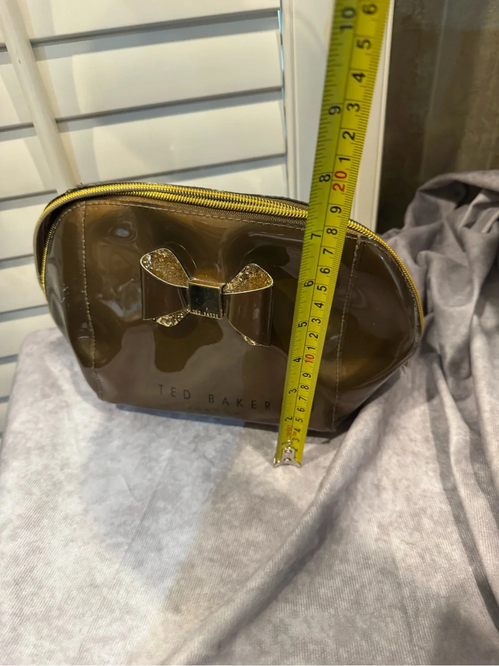Ted Baker Brown Glossy Bronze Cosmetic Pouch with Glitter Bow Accent